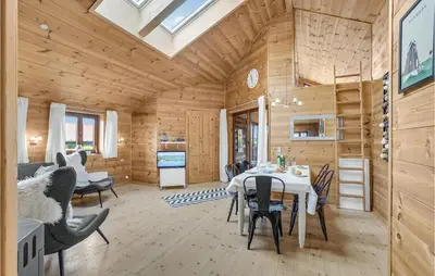 a dining room with a table and chairs in a room at Gorgeous Home In Vinderup With Sauna in Vinderup