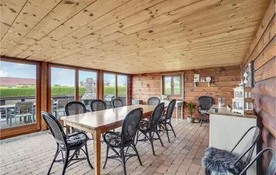 a dining room with a table and chairs at Gorgeous Home In Vinderup With Sauna in Vinderup
