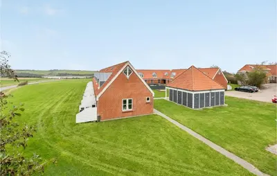 an aerial view of a house and a building at Gorgeous Apartment In Lemvig in Lemvig