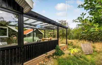 a house with a solarium on the side of it at 3 Bedroom Nice Home In Hurup Thy in Sønder Ydby
