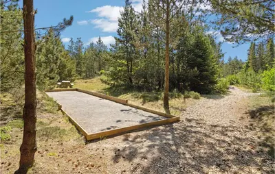 a wooden platform in the middle of a forest at 4 Bedroom Lovely Home In Fjerritslev in Fjerritslev