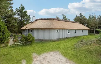an old building with a grass roof on a field at 4 Bedroom Lovely Home In Fjerritslev in Fjerritslev