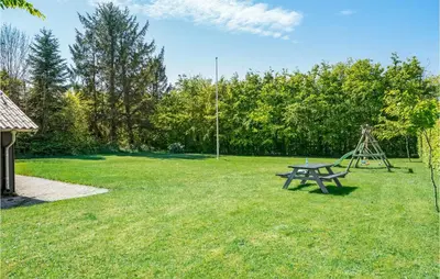 a park with a picnic table and a playground at 3 Bedroom Cozy Home In Højslev in Højslev
