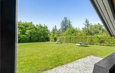 a backyard with a soccer field with a goal at 3 Bedroom Cozy Home In Højslev in Højslev