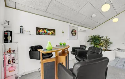 a room with black chairs and a table in a room at Pet Friendly Home In Farsø With Sauna in Farsø