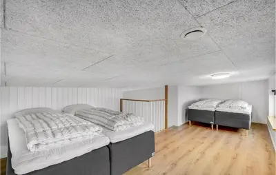a bedroom with two beds and a ceiling at Lovely Home In Løgstrup With Wifi in Løgstrup