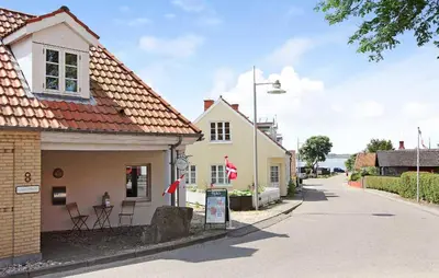 a street in a small town with a building at 4 Bedroom Stunning Home In Løgstrup in Løgstrup