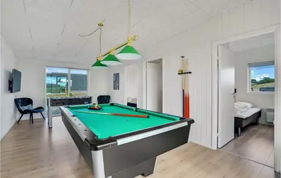 a living room with a pool table in it at 4 Bedroom Stunning Home In Løgstrup in Løgstrup