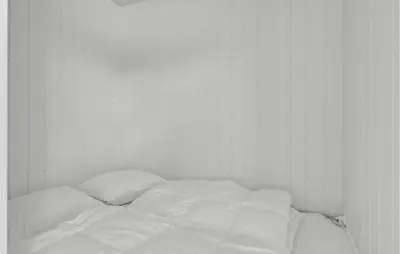 an unmade bed with white sheets and pillows at Beautiful Home In Løgstrup With Kitchen in Løgstrup