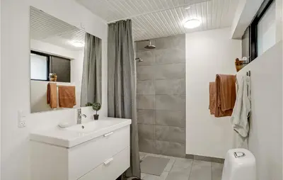 a white bathroom with a sink and a toilet at Lovely Home In Højslev With Wifi in Højslev