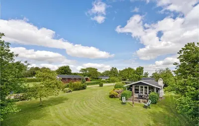 an aerial view of a yard with a house at Gorgeous Home In Farsø With Kitchen in Farsø