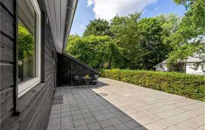 a patio on the side of a house at Amazing Home In Farsø With Wifi in Farsø