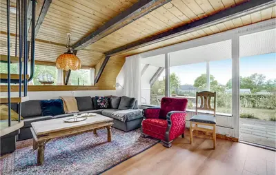 a living room with a couch and two chairs at Nice Home In Løgstrup With Wifi in Løgstrup