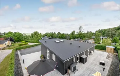 an aerial view of a black house with a courtyard at Cozy Home In Farsø With Wifi in Farsø