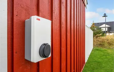 a red wall with a thermostat on a building at Amazing Home In Blokhus With Wifi in Blokhus