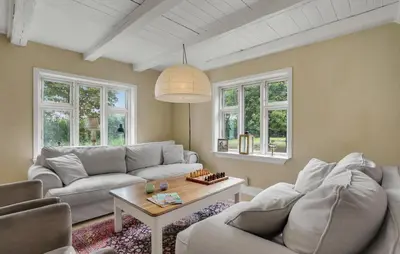 a living room with a couch and a table at Pet Friendly Home In Roslev With Wifi in Roslev