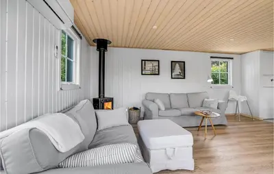a living room with a couch and a table at Beautiful Home In Vinderup With Kitchen in Vinderup