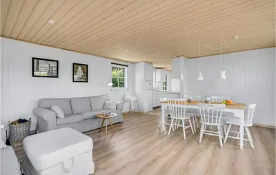 a living room with a couch and a table at Beautiful Home In Vinderup With Kitchen in Vinderup