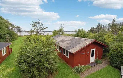 an aerial view of a red house with a yard at 3 Bedroom Cozy Home In Spøttrup in Spottrup