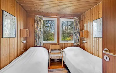 two beds in a room with a window at 3 Bedroom Cozy Home In Spøttrup in Spottrup
