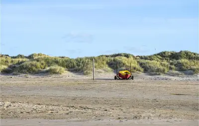 a tent in the middle of a sandy beach at 3 Bedroom Amazing Home In Pandrup in Pandrup