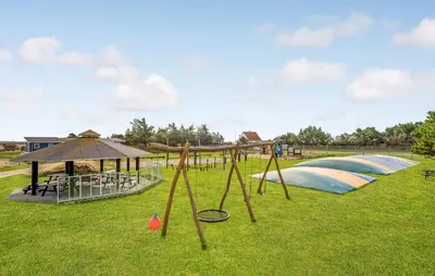 a park with a playground with a swing set at Lovely Home In Vestervig With Kitchen in Vestervig