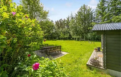a picnic table in the middle of a yard at Lovely Home In Spøttrup in Spottrup