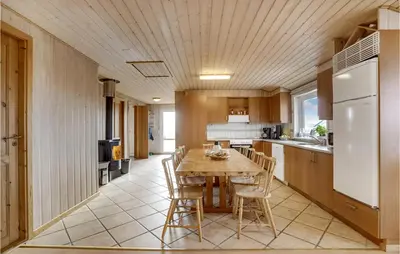 a kitchen with a table and chairs in a kitchen at Awesome Home In Lemvig With Wifi in Lemvig