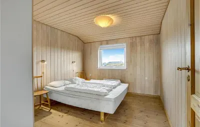 a bedroom with a bed in a room with a window at Awesome Home In Lemvig With Wifi in Lemvig