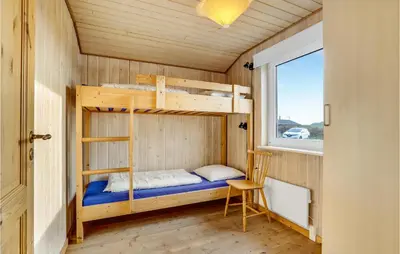 a bedroom with bunk beds in a tiny house at Awesome Home In Lemvig With Wifi in Lemvig