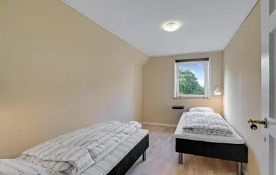 two beds in a room with a window at 3 Bedroom Nice Home In Fur in Fur