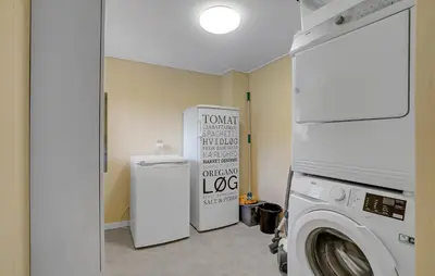 a laundry room with a washing machine and a refrigerator at 3 Bedroom Nice Home In Fur in Fur