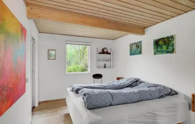 a bedroom with two beds and a window at Nice Home In Roslev With Kitchen in Roslev