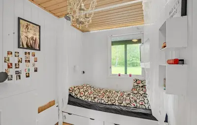 a small room with a bed in the wall at Nice Home In Roslev With Kitchen in Roslev