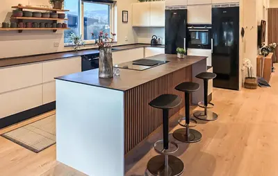 a kitchen with a island with bar stools at Lovely Home In Spøttrup With Wifi in Spottrup