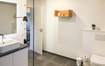 a bathroom with a sink and a toilet at Lovely Home In Spøttrup With Wifi in Spottrup