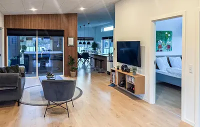 a living room with a couch and a television at Lovely Home In Spøttrup With Wifi in Spottrup