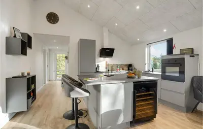 a kitchen with a counter and a stove top oven at Nice Home In Hurup Thy With Wifi in Sindrup