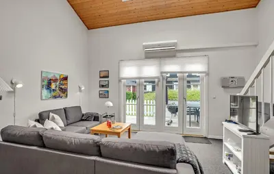 a living room with a couch and a tv at Awesome Apartment In Vestervig in Vestervig