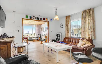 a living room with a couch and a table at Beautiful Home In Nykøbing M With Wifi in Sønder Dråby