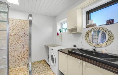 a kitchen with a sink and a washing machine at Beautiful Home In Nykøbing M With Wifi in Sønder Dråby