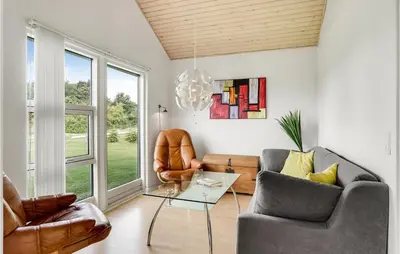 a living room with two chairs and a glass table at Stunning Home In Løgstør With Wifi in Løgstør