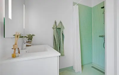 a white bathroom with a sink and a shower at Amazing Home In Spøttrup With Wifi in Spottrup
