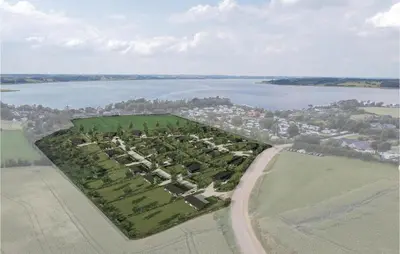 an aerial view of a large group of trees next to a lake at Gorgeous Home In Løgstrup With Kitchen in Løgstrup