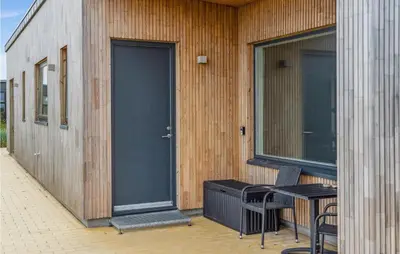 a door on the side of a building with a bench at 3 Bedroom Lovely Home In Fjerritslev in Fjerritslev