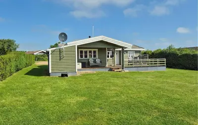 a small green house with a large grass yard at Stunning Home In Hurup Thy With Wifi in Doverodde