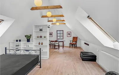 a room with a bed and a dining room at Lovely Home In Hurup Thy With Wifi in Gettrup