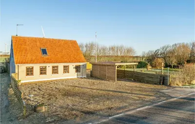 a small house with an orange roof in a field at Lovely Home In Hurup Thy With Wifi in Gettrup