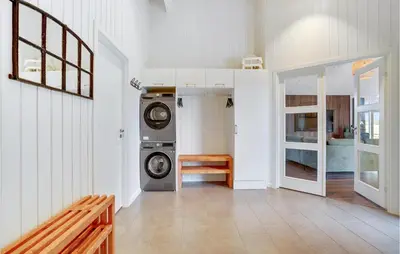a laundry room with a washer and dryer at Cozy Home In Spøttrup With Wifi in Spottrup