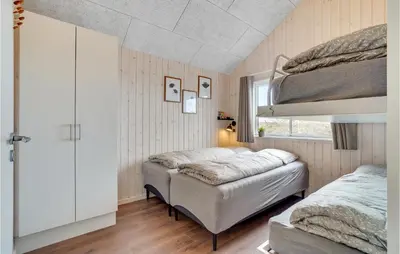 a bedroom with two bunk beds and a window at Cozy Home In Spøttrup With Wifi in Spottrup